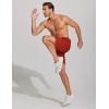 imageCOOFANDY Mens Athletic Running Shorts 7 Gym Workout Shorts Lightweight Drawstring Training Shorts with Zipper PocketsBlakWine Red