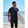 imageCOOFANDY Mens Swim Shirt Short Sleeve UPF 50 Sun Protection Shirt Rah Guard Athletic Quick Dry T ShirtsMightnight Blue