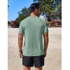 imageCOOFANDY Mens Swim Shirt Short Sleeve UPF 50 Sun Protection Shirt Rah Guard Athletic Quick Dry T ShirtsTeal