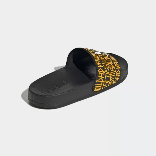 imageadidas Kids Adilette Shower SlideCore BlackWhiteSemi Solar Gold Messi