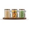 imageJoyJolt Holden 14oz Stackable Glass Storage Containers with Lids and Wooden Tray Small Airtight Food Canister Set of 3 with Acacia Wood Lids Round Clear Stacking Pantry and Kitchen ContainersJW10580