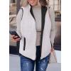 imageSHEWIN Women Puffer Vest Casual Stand Collar Sleeveless Puffer Jacket Warm Winter Reversible Zip Up Outerwear with PocketsBlack