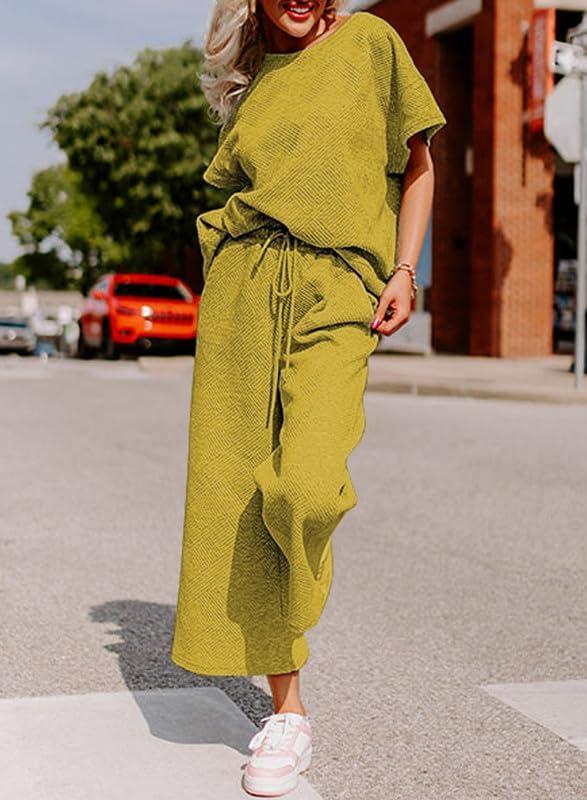imageSHEWIN Womens 2 Piece Outfits Sweatsuit Casual Short Sleeve Pullover Tops and Drawstring Wide Leg Pants Lounge SetsYellow