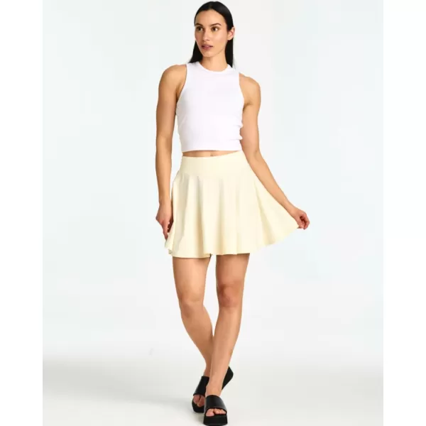 imageReal Essentials 4 Pack Womens Soft Casual Pleated Mini Skirt  Skater ALine Flowy Skirts Available in Plus SizeSet 4