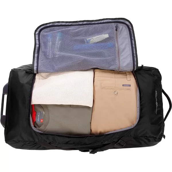 imageEddie Bauer Traverse 32 Rolling Duffel BagMade from Ripstop Polyester with Telescoping Handle Black One SizeEddie Bauer Traverse 32 Rolling Duffel BagMade from Ripstop Polyester with Telescoping Handle Black One Size