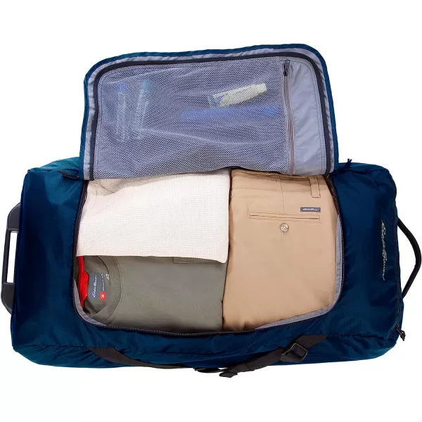 imageEddie Bauer Traverse 32 Rolling Duffel BagMade from Ripstop Polyester with Telescoping HandleMedium Indigo