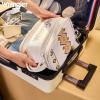 imageMontana West X Wrangler Large Makeup Bag Travel Toiletry Bag Portable Cosmetic Bag Make Up Organizer with Divider and Handle for Women AztecAztecTan